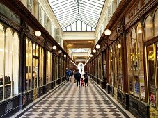 People passing through Gallery Vero Dodat in Paris, France