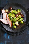 Glazed Brussels sprouts with chestnuts and duck breast
