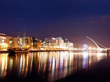 View of illuminated Samuel Becket Bridge at night, Dublin, Ireland, UK