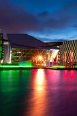 View of Grand Canal Hotel in colourful lights at dusk, Dublin, Ireland, UK