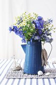 Wild flowers in enamel coffee pot