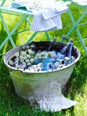 Drinks cooling in zinc tub with flowers