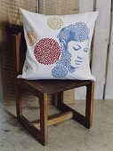 Pillowcase with woman portrait on wooden chair