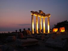 Illuminated Temple of Apollo ruins at night in Side, Turkey