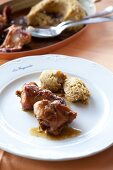 Close-up of rabbit with polenta on dish at Restaurant La Fagurida, Tremezzo, Italy