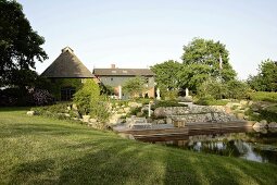 View of farm house and lake