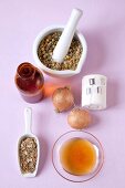 Home remedies - chamomile, onion, vinegar, honey and lime blossom on pink background
