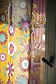 Floral pattern curtain on window