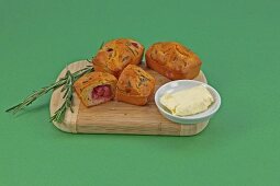 Mini cakes with goat cheese and grapes on wooden tray