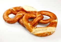 Two pretzels on white background