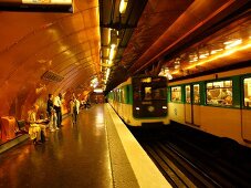 Senior woman waiting at Arts et Metiers metro station in Paris, France