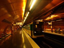 Senior woman waiting at Arts et Metiers metro station in Paris, France