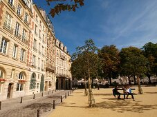 Buildings at Place Dauphine square in Ile de la Cite island, Paris, France