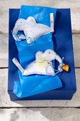 View of elephant shaped hand warmers on blue box