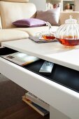 Coffee table with glass teapot and glass cup