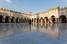 People enjoying at park and Al-Azhar Mosque in the background, Cairo, Egypt