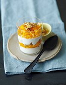 Yogurt cream with mango and walnuts