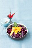Red cabbage salad with chilli and mango