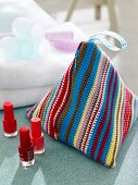 Colourful striped pyramid shaped crochet bag