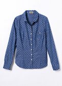 Close-up of blue polka dot shirt blouse on white background