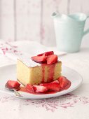 Almond cake with strawberries and strawberry sauce