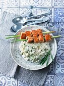 Lemongrass and salmon skewers on a bed of fennel risotto
