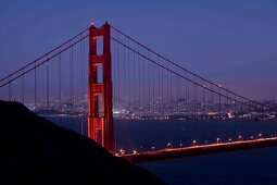 Illuminated Golden Gate Bridge at dusk, San Francisco, California, USA