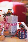 Wrapped Christmas presents decorated with birds