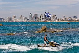 Man riding jet ski in Mediterranean Sea, Tel Aviv, Israel