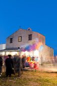 People at Sant'Efisio Church at blue hour, Nora, Cagliari, Sardinia, Italy, blurred motion