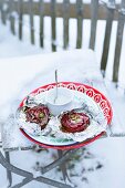 Beetroot with wasabi sour cream on a piece of aluminium foil in the snow