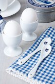 Close-up of egg cups with spoons