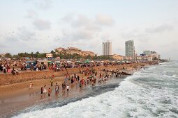People at promenade, enjoying on beach in front of Galle Face Hotel, Colombo, Sri Lanka