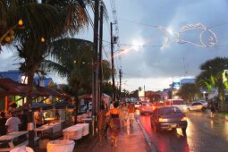 View of shops and vehicles on street at Lesser Antilles, Caribbean island, Barbados