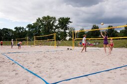 People playing beach volleyball at Friedrichshain Public Park in Berlin, Germany