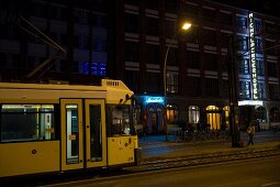 Tram in front of Michelberger hotel at night, Friedrichshain, Berlin, Germany