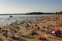 People relaxing and enjoying at Strandbad Wannsee beach, Berlin, Germany