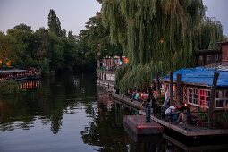 People relaxing at Club der Visionaere, Treptow, Berlin, Germany