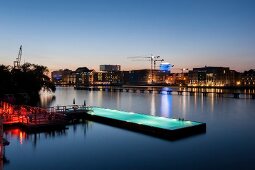 View of bathing ship pool on Spree river at dusk, Wrangelkiez, Berlin, Germany