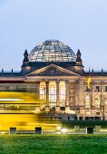 Illuminated Reichstag building at dusk, Berlin, Germany