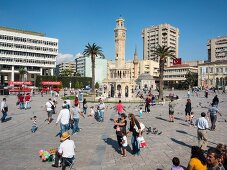 People at Konak Square in front of Izmir Clock Tower in Aegean Region, Turkey