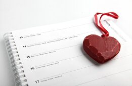 Red heart on calendar with date of 14th February