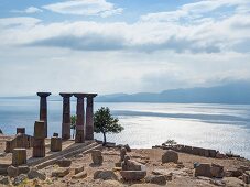 Tourists photographing at Temple of Athena near sea in Turkey