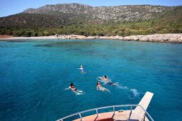 People swimming in Mediterranean peninsula, Aegean, Turkey