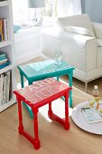 Blue and red side tables with text on table