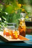 Punch in glasses and a carafe in the open air