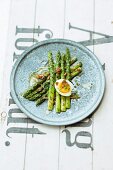 Green asparagus with a tomato vinaigrette and a boiled egg