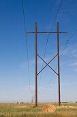 Landscape view of power pole and straw bales on Highway 15,  Saskatchewan, Canada