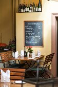 Laid table and black eagle wine in restaurant in the Scheunel, Freiburg, Germany