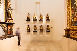 Busts of saints of Freiburg guilds in Augustiner Museum, Freiburg, Germany, blurred motion